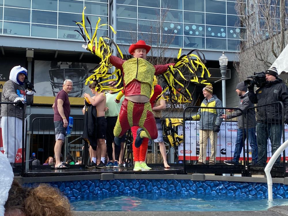Christopher Luning jumping in the water for the 2023 Pittsburgh Polar Plunge