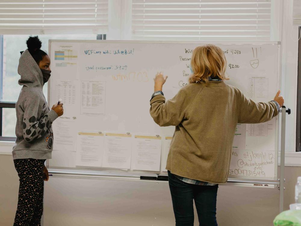 Student and mentor working together in one of Urban Impact's Learning Labs.