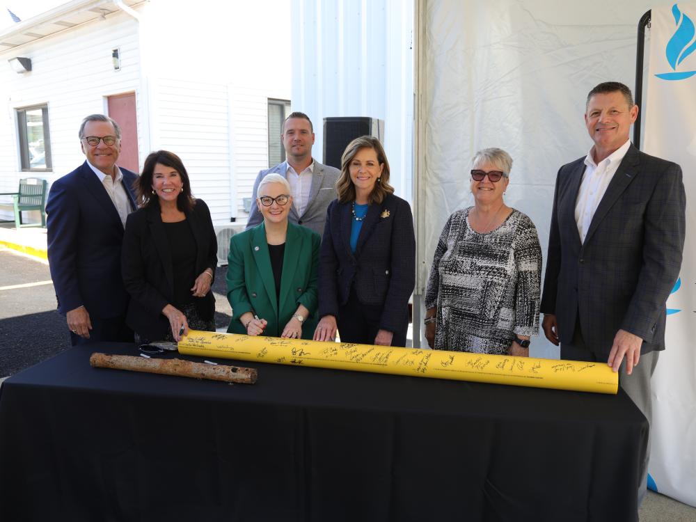 group of people at ribbon cutting
