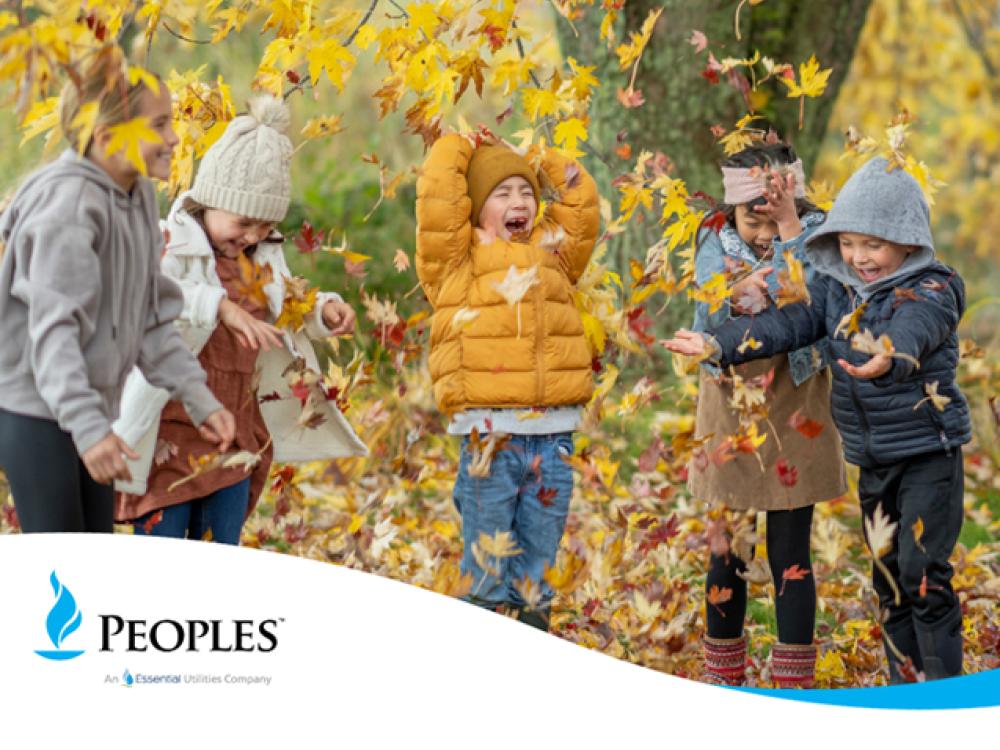 kids jumping in leaves