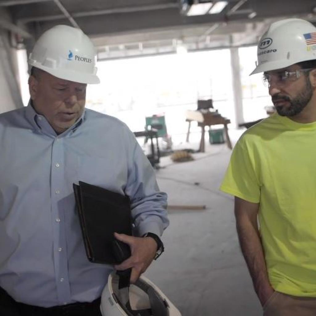 two men with hardhats